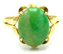 A 14ct gold ring set with jade, stone 12mm x 10mm,