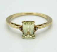 A 10ct gold ring set with lemon topaz & diamond, 1