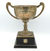 A mounted silver trophy inscribed 