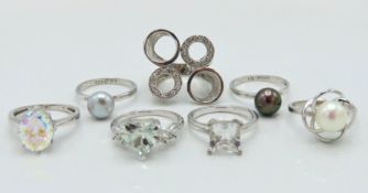 Seven sterling silver rings set with various stone