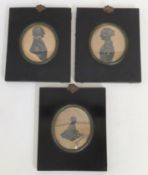 Three Georgian framed silhouettes of a couple with