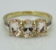 A 10ct gold ring set with white topaz & possibly m