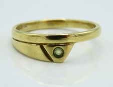 An 18ct gold ring of avant-garde styling set with