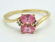 A 10ct gold ring set with pink sapphire & diamond,