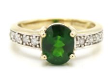 A 9ct gold ring set with diopside & 0.16ct of diam