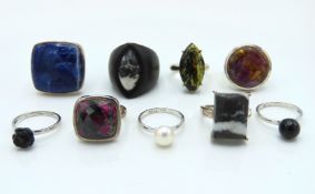 Nine sterling silver rings set with various stones