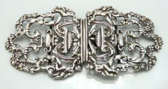 An antique nurses white metal buckle, tests as sil