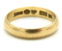 A Swedish 18ct gold band, date mark for 1954, 3.9g