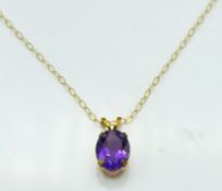 A 9ct gold chain & pendant set with amethyst, 0.9g