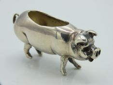 A .925 sterling silver pig pin cushion lacking cus