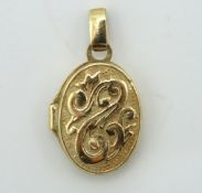 A small 9ct gold locket with carved decor, 18mm dr