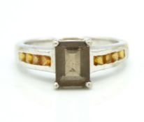 A sterling silver smoky ring set with quartz & Son