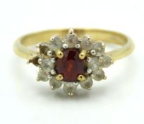 A 9ct gold spessartite garnet & white topaz ring,