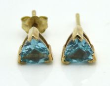 A pair of 9ct gold earrings set with apatite, lack