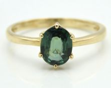 A 10ct gold ring set with green sapphire, 1.8g, si