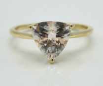 A 10ct gold ring set with trilliant cut stone, pos