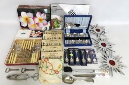 A quantity of various household items including three retro trivets, Ormerod nutcrackers, twelve Por