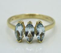 A 10ct gold three stone aquamarine ring, 2.2g, siz
