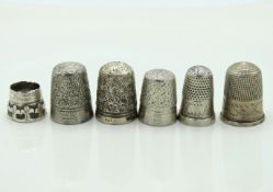 Five white metal thimbles & one a/f, two marked CH