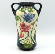 A Moorcroft pottery twin handled vase signed by Ra