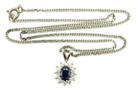 An 18ct white gold chain & sapphire pendant set wi
