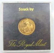 A Royal Mint 24ct gold 1/4oz Britannia coin