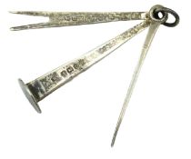 A 1911 Birmingham silver pipe tamper tool by Willi