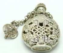 A Tibetan white metal snuff bottle with fretwork d
