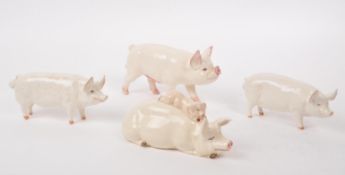 BESWICK - A COLLECTION OF FOUR 20TH CENTURY FARM ANIMAL PIGS