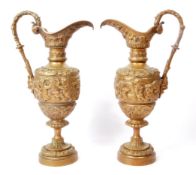 TWO VINTAGE 20TH CENTURY BRASS REPOUSSE EWERS