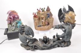 COLLECTION OF FOUR RESIN / PLASTIC DRAGON LIGHT-UP FIGURES
