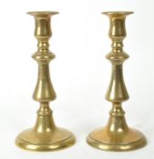 A PAIR OF EARLY 20TH CENTURY BRASS CANDLESTICK HOLDERS