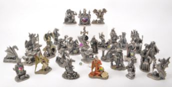 MYTH & MAGIC - THIRTY-TWO CAST PEWTER DRAGON AND WIZARD FIGURES