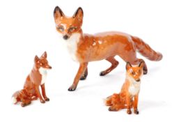 BESWICK - THREE 20TH CENTURY PORCELAIN FOX FIGURINES