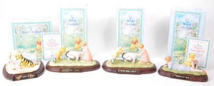 ROYAL DOULTON - FOUR LATE 20TH CENTURY WINNIE THE POOH FIGURINES