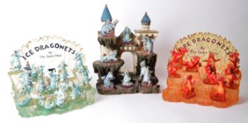 THE TUDOR MINT - THREE RESIN STANDS HOUSED WITH DRAGON FIGURES