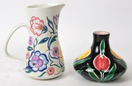 PAIR OF LATE 20TH-CENTURY FLORAL POTTERY PIECES