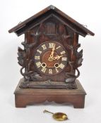 EARLY 20TH CENTURY CARVED WOODEN MANTEL CUCKOO CLOCK