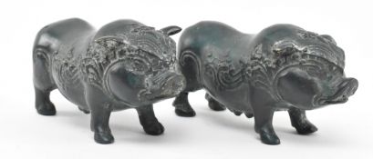 PAIR OF INDONESIAN LOST WAX BRONZE ORNATE FIGURES OF WILD PIGS