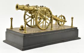 19TH CENTURY BRASS CANNON SCULPTURE ON EBONISED PLINTH BASE