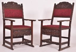 PAIR OF 19TH CENTURY CARVED OAK THRONE HALL CHAIRS - CARVER ARMCHAIRS