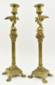 PAIR OF 19TH CENTURY GRAND TOUR BRASS CANDLESTICKS WITH EAGLE CAPITOLS