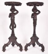 PAIR OF ITALIAN 19TH CENTURY EBONISED BLACKAMOOR TORCHERE PLANT STANDS