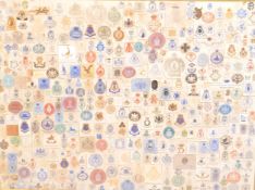 FRAMED AND GLAZED PRESENTATION OF REGIMENTAL BADGES AND STAMPS