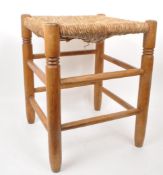 VINTAGE MID-CENTURY PINE TURNED RUSH SEATED STOOL