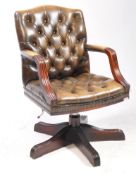 20TH CENTURY CHESTERFIELD STYLE LEATHER & MAHOGANY CAPTAINS SWIVEL ARMCHAIR