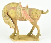TANG DYNASTY PAINTED POTTERY FIGURE OF A HORSE 唐 陶加彩马