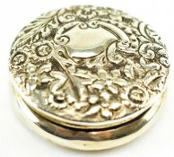 A SMALL VICTORIAN HALLMARKED EMBOSSED SILVER PILL BOX