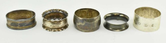 TWO VICTORIAN HALLMARKED SILVER NAPKIN RINGS AND THREE OTHERS