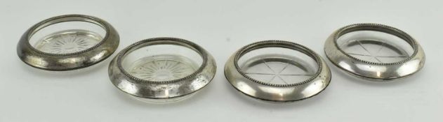 COLLECTION OF FOUR 20TH CENTURY SILVER MOUNTED GLASS COASTERS